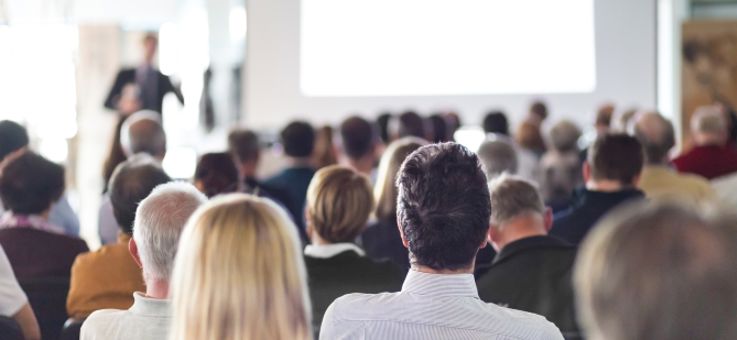 Speaker Giving a Talk at Business Meeting