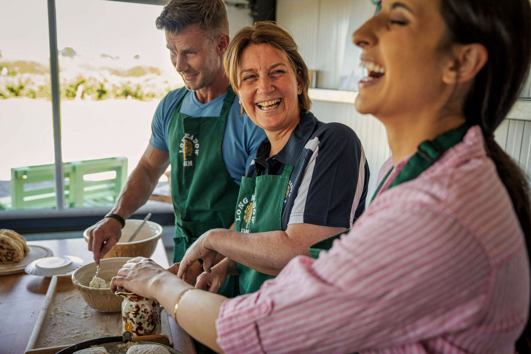 Visitors baking bread as part of Long Meadow Orchard Cider Experience