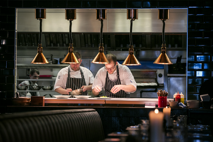 Chefs preparing dishes of food to be served in the Coppi restaurant. Located in Belfast’s buzzing Cathedral Quarter, Co Antrim.