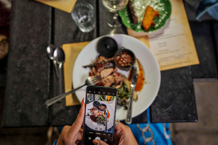 Customer taking pinterest photo of their meal