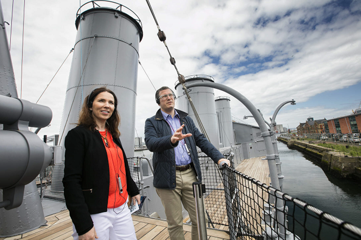 Visitors enjoying an audio tour onboard HMS Caroline