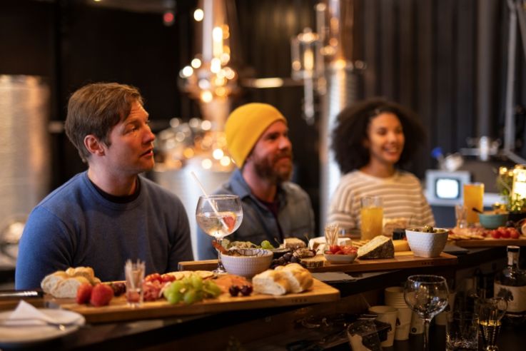 People enjoying their food & drink offering as part of the Wild Atlantic Distillery Gin School and Distillery Tour