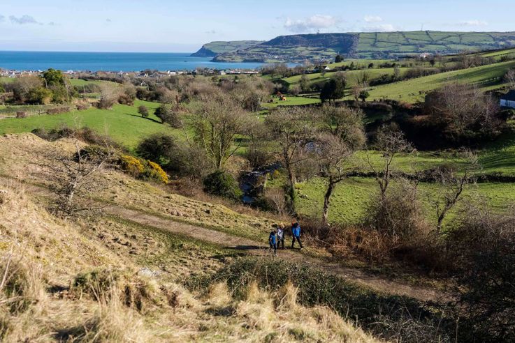 Hikers walking Carnlough Hill 